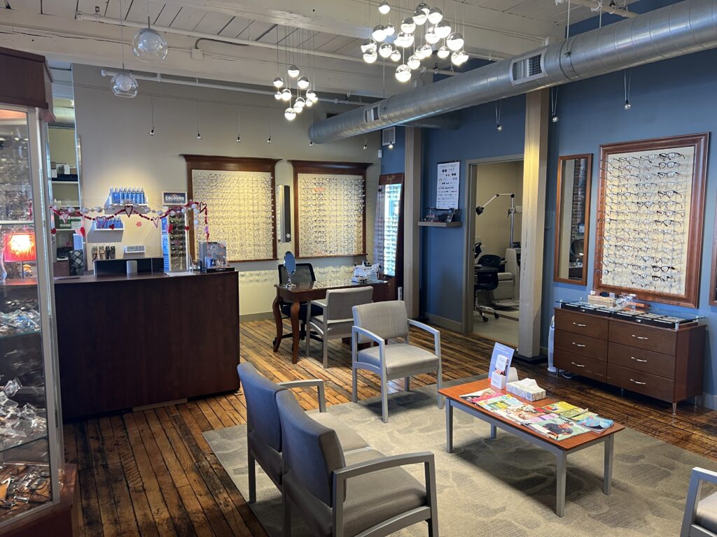 wide angle shot of the waiting room area and optical shop displays at the optical shop in Northampton MA